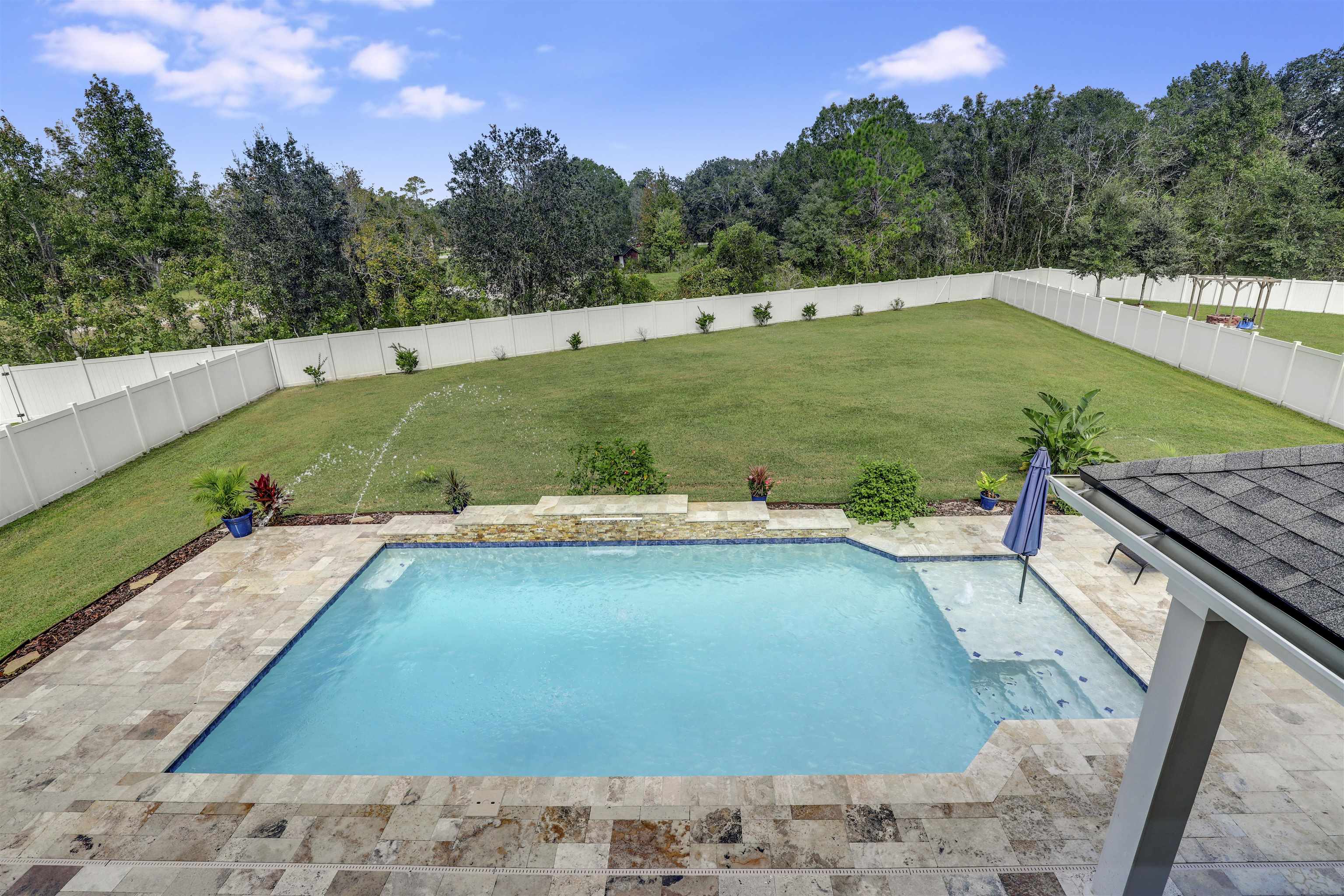 93 Firefly Trace St. Augustine, FL 32092 - Photo 52 of 76 a view of a swimming pool with a yard