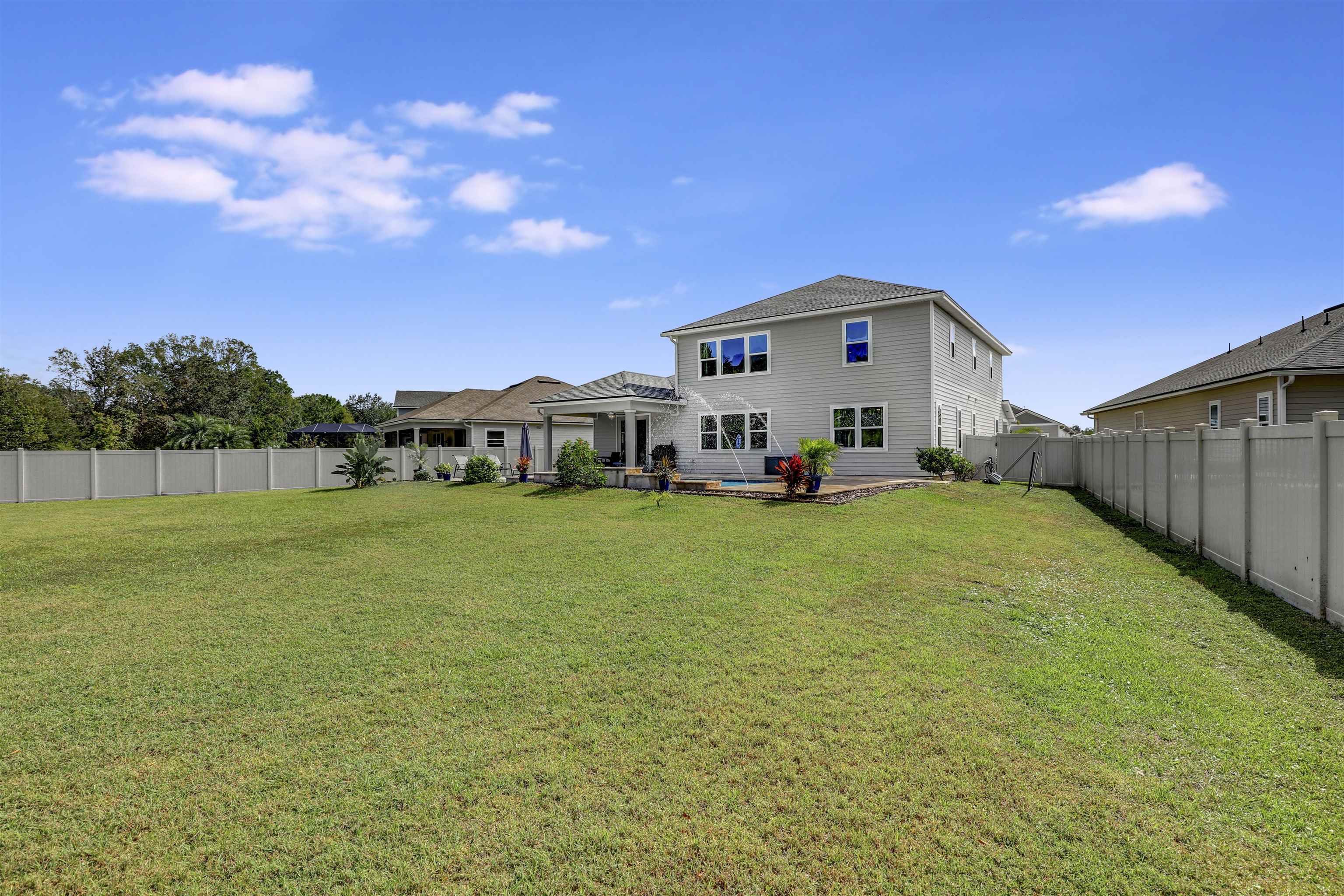 93 Firefly Trace St. Augustine, FL 32092 - Photo 55 of 76 a house view with a garden space