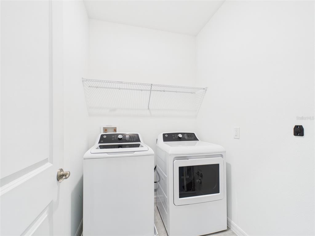 2033 Emerald Springs Drive Apopka, FL 32712 - Photo 14 of 49 a utility room with dryer and washer