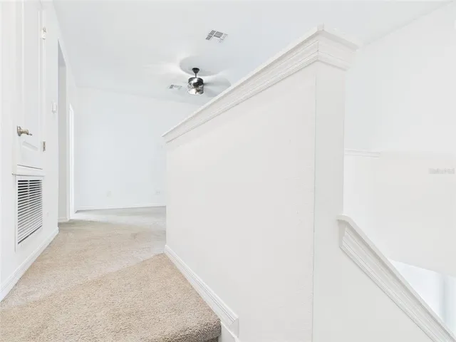 a view of room with ceiling fan