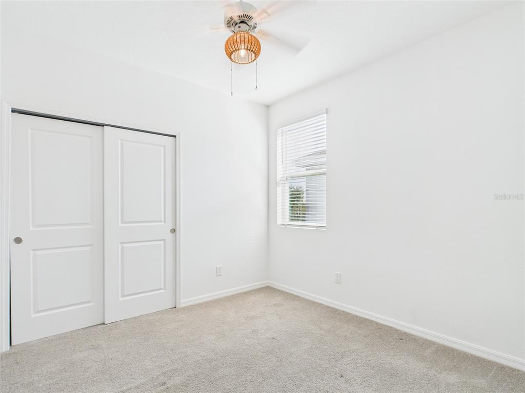 2033 Emerald Springs Drive Apopka, FL 32712 - Photo 21 of 49 a view of an empty room with a window