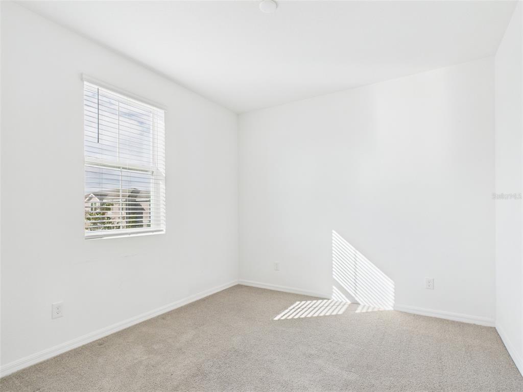 2033 Emerald Springs Drive Apopka, FL 32712 - Photo 26 of 49 a view of an empty room with a window