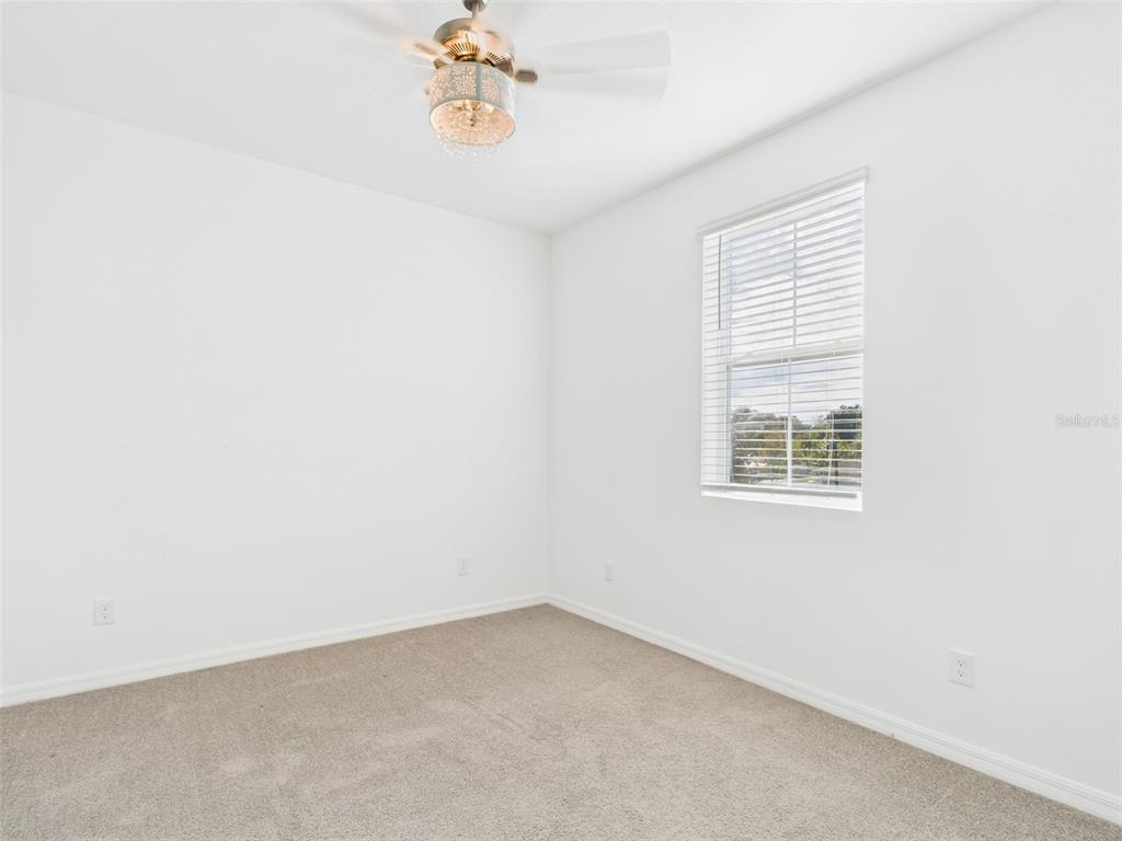 2033 Emerald Springs Drive Apopka, FL 32712 - Photo 27 of 49 an empty room with a window
