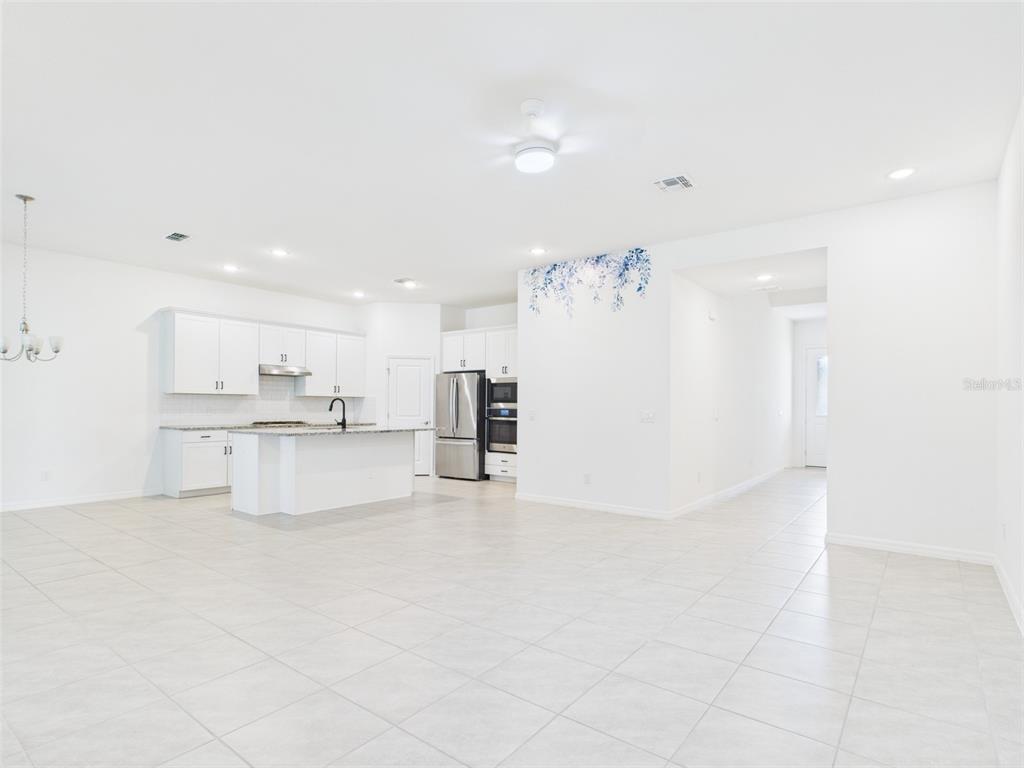 2033 Emerald Springs Drive Apopka, FL 32712 - Photo 5 of 49 a view of kitchen with refrigerator and window