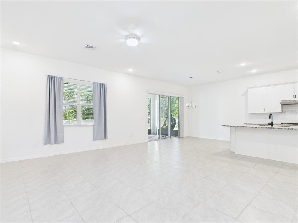 2033 Emerald Springs Drive Apopka, FL 32712 - Photo 8 of 49 a view of an empty room with a window