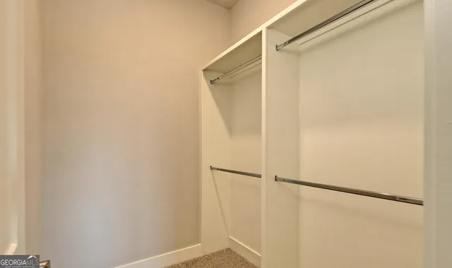 a bathroom with a granite countertop toilet a sink and a bathtub