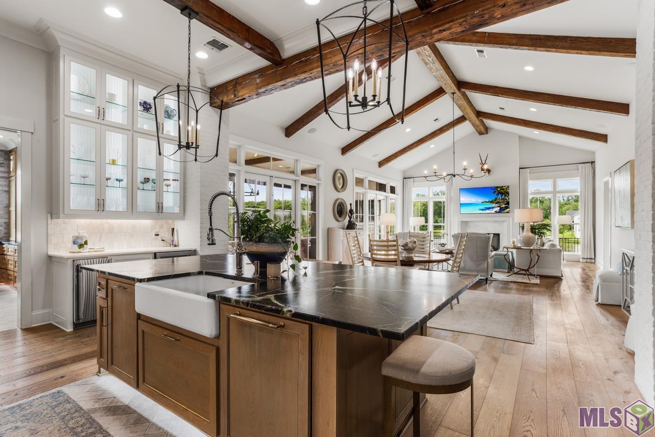 11354 Preservation Way Baton Rouge, LA 70810 - Photo 13 of 42 Reclaimed beams highlight the vaulted ceiling