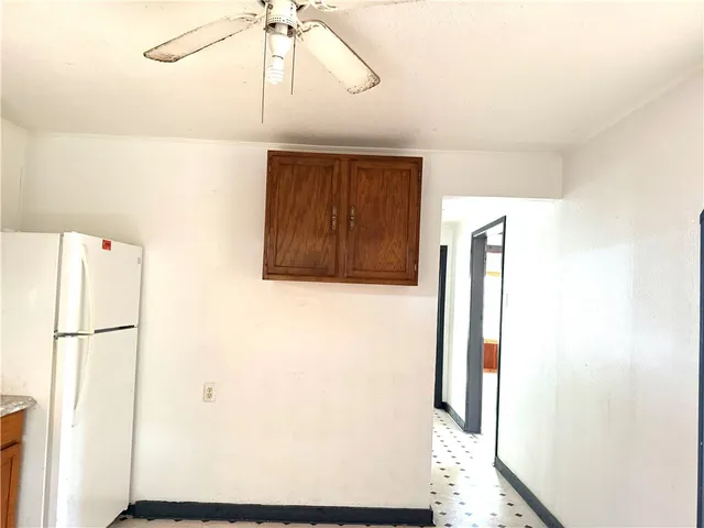 a view of an empty room and a window