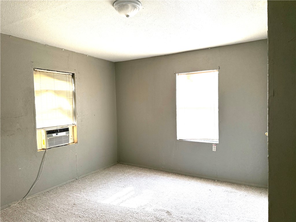 147 County Road 153 Alice, TX 78332 - Photo 17 of 23 a view of an empty room and a window