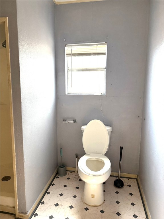 147 County Road 153 Alice, TX 78332 - Photo 18 of 23 a white toilet sitting next to a bathroom sink