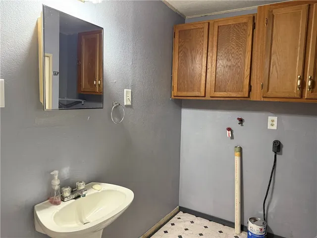 a bathroom with a glass shower door