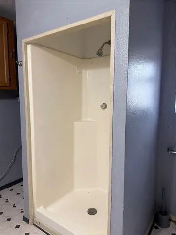 a view of a livingroom with wooden floor and a window