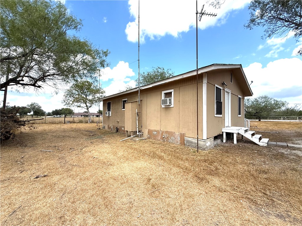 147 County Road 153 Alice, TX 78332 - Photo 5 of 23 a big white house with a yard and garage