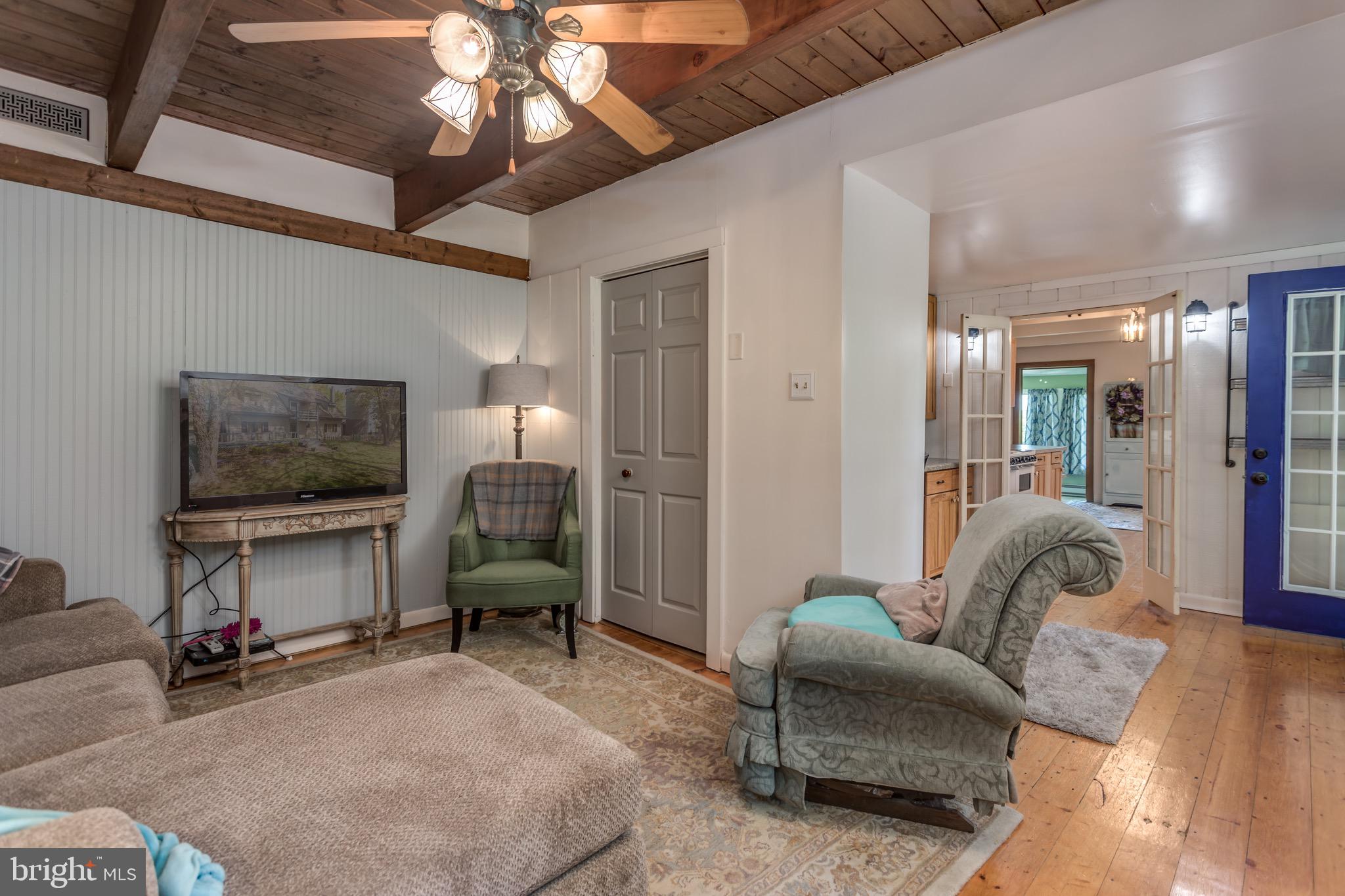 418 Buffalo Marsh Road Middletown, VA 22645 - Photo 22 of 54 TV room with pine floors