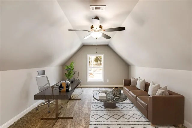 a living room with furniture a chandelier and a window