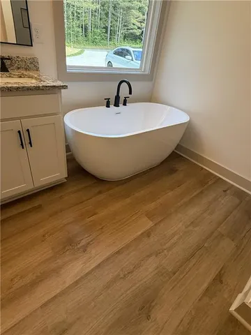 a view of a kitchen with sink and window