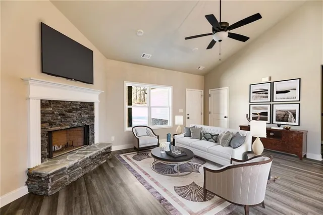 a living room with furniture and a fireplace