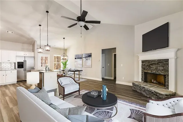 a living room with furniture and a fireplace