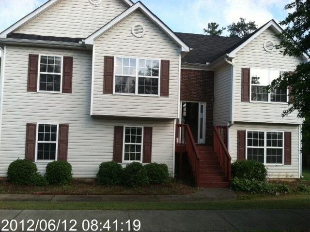 2444 Trace Pond Circle Southwest Grayson, GA 30017 - Photo 1 of 1 a front view of a house with a yard
