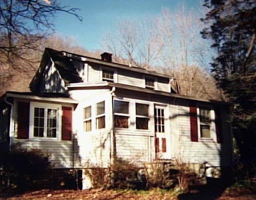 703 Danbury Road Wilton, CT 06897 - Photo 1 of 1 front view of a house with a yard
