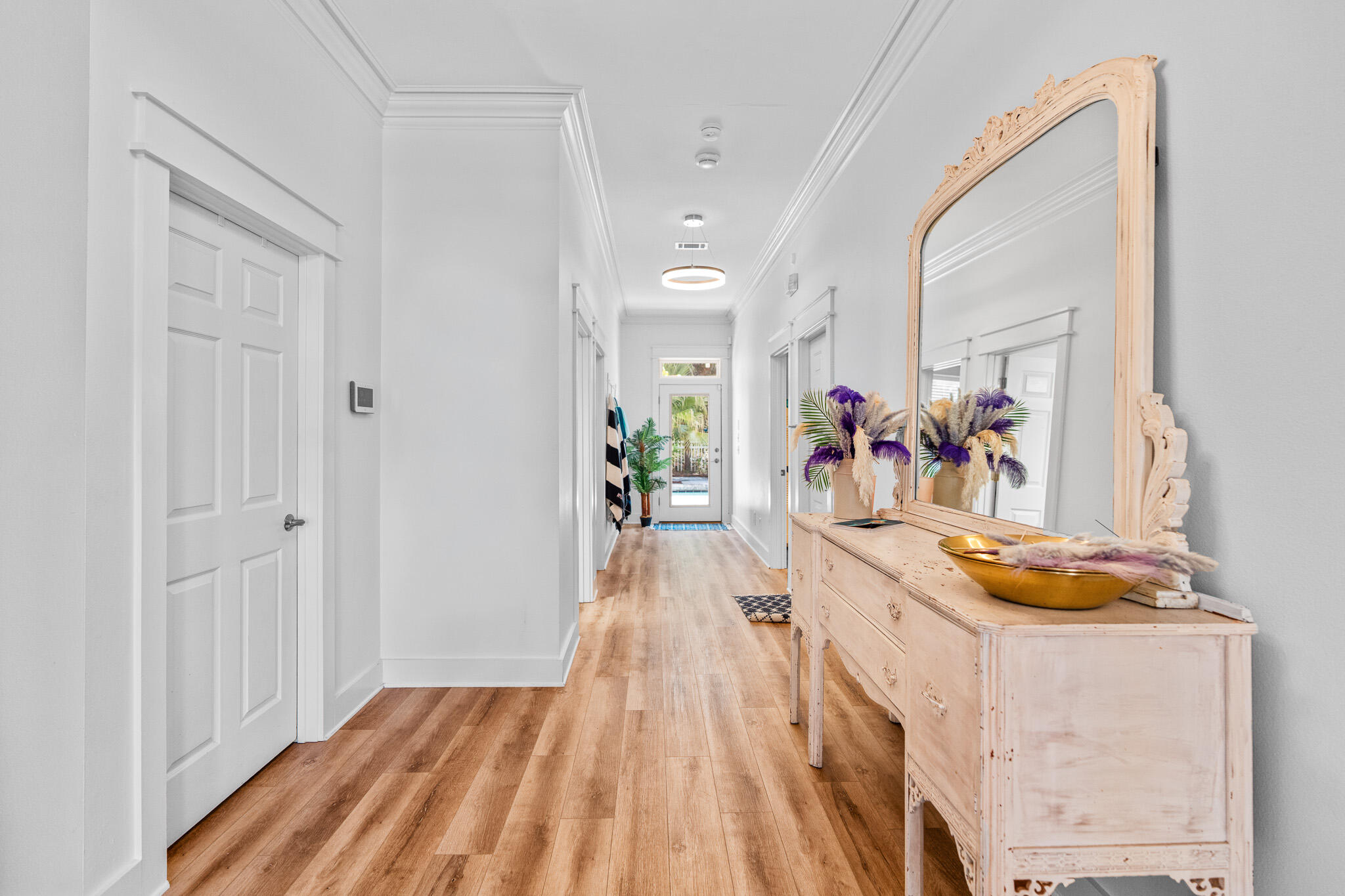 15 Beachwalk Lane Santa Rosa Beach, FL 32459 - Photo 6 of 26 a view of a hallway with wooden floor and furniture