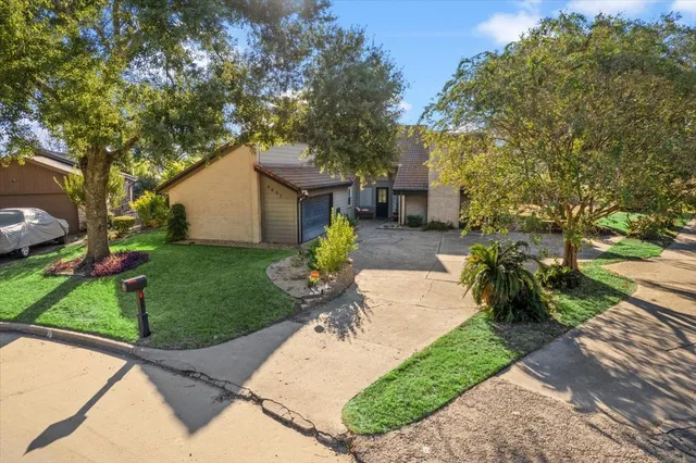 a view of a garden with a patio
