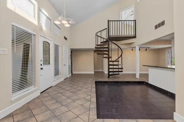 a view of entryway with stairs and wooden floor