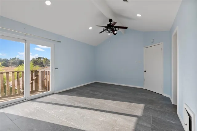 an empty room with a empty space and windows