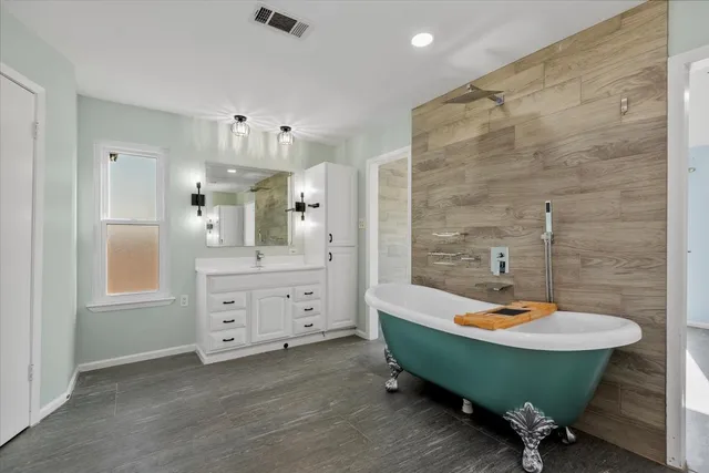 a bathroom with a sink and a large mirror