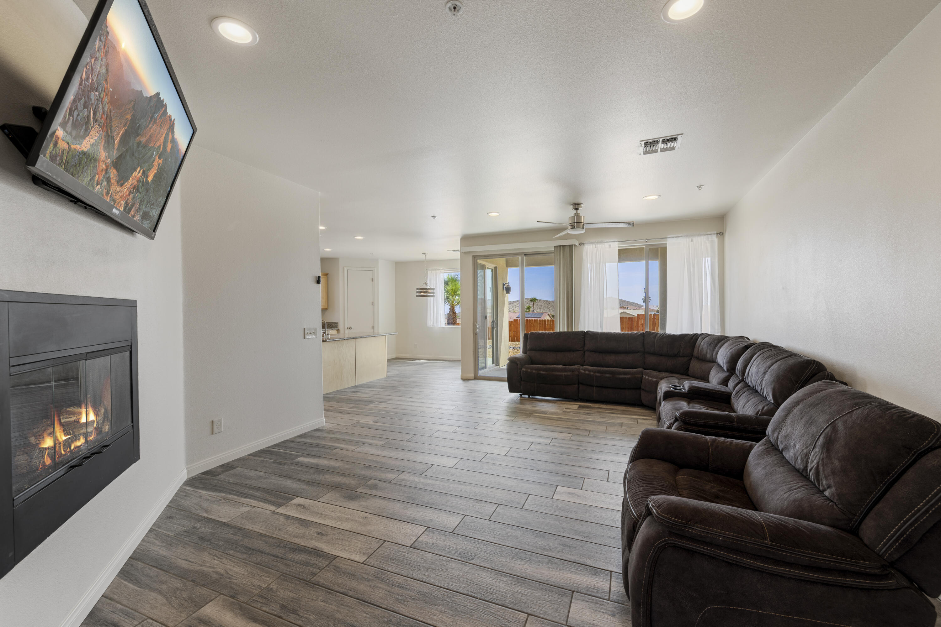 8680 Monument View Drive Yucca Valley, CA 92284 - Photo 11 of 51 a living room with furniture and a fireplace