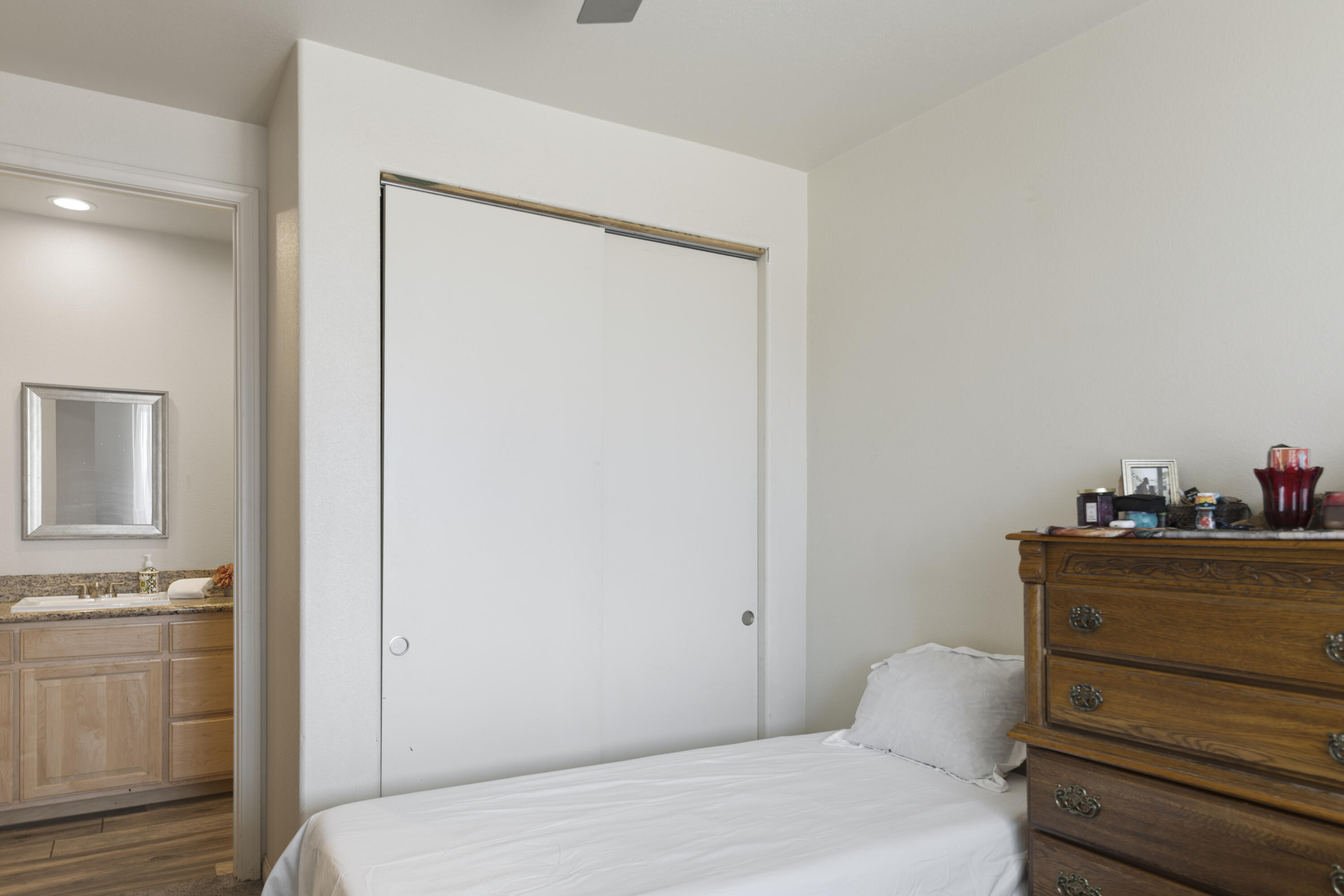 8680 Monument View Drive Yucca Valley, CA 92284 - Photo 20 of 51 a bedroom with a bed and cabinets