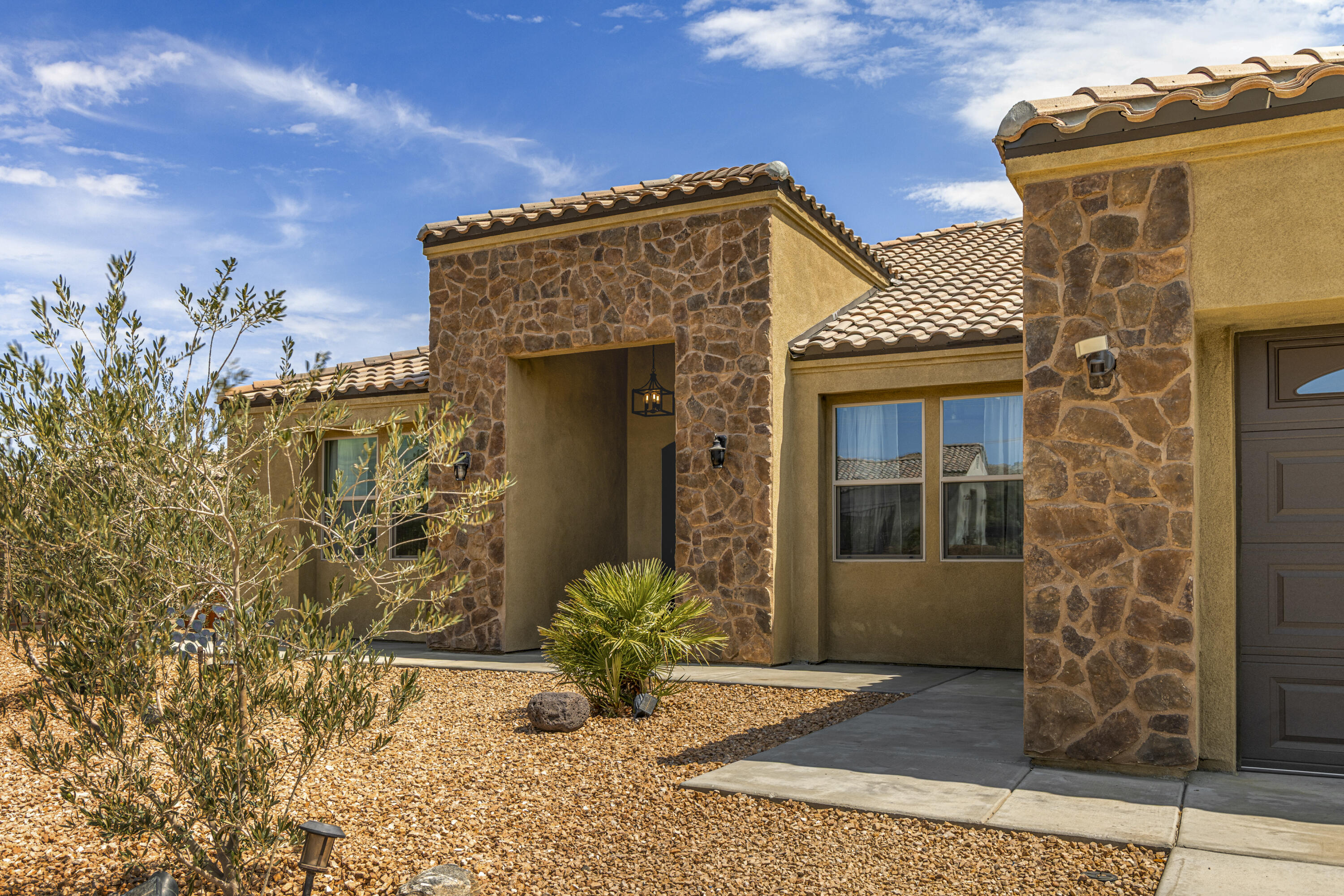 8680 Monument View Drive Yucca Valley, CA 92284 - Photo 2 of 51 a view of a house with potted plants