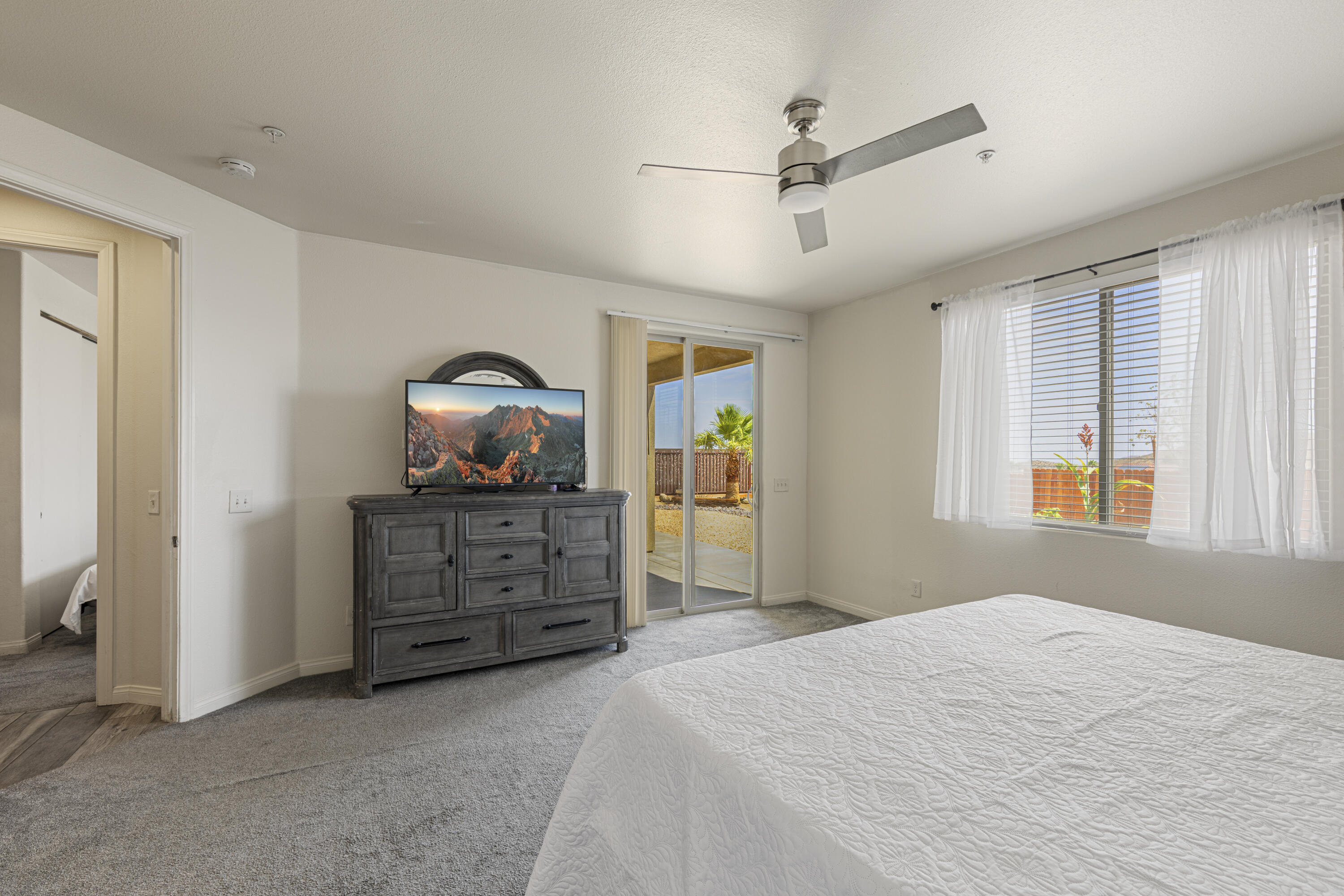 8680 Monument View Drive Yucca Valley, CA 92284 - Photo 22 of 51 a bedroom with a bed and a dresser