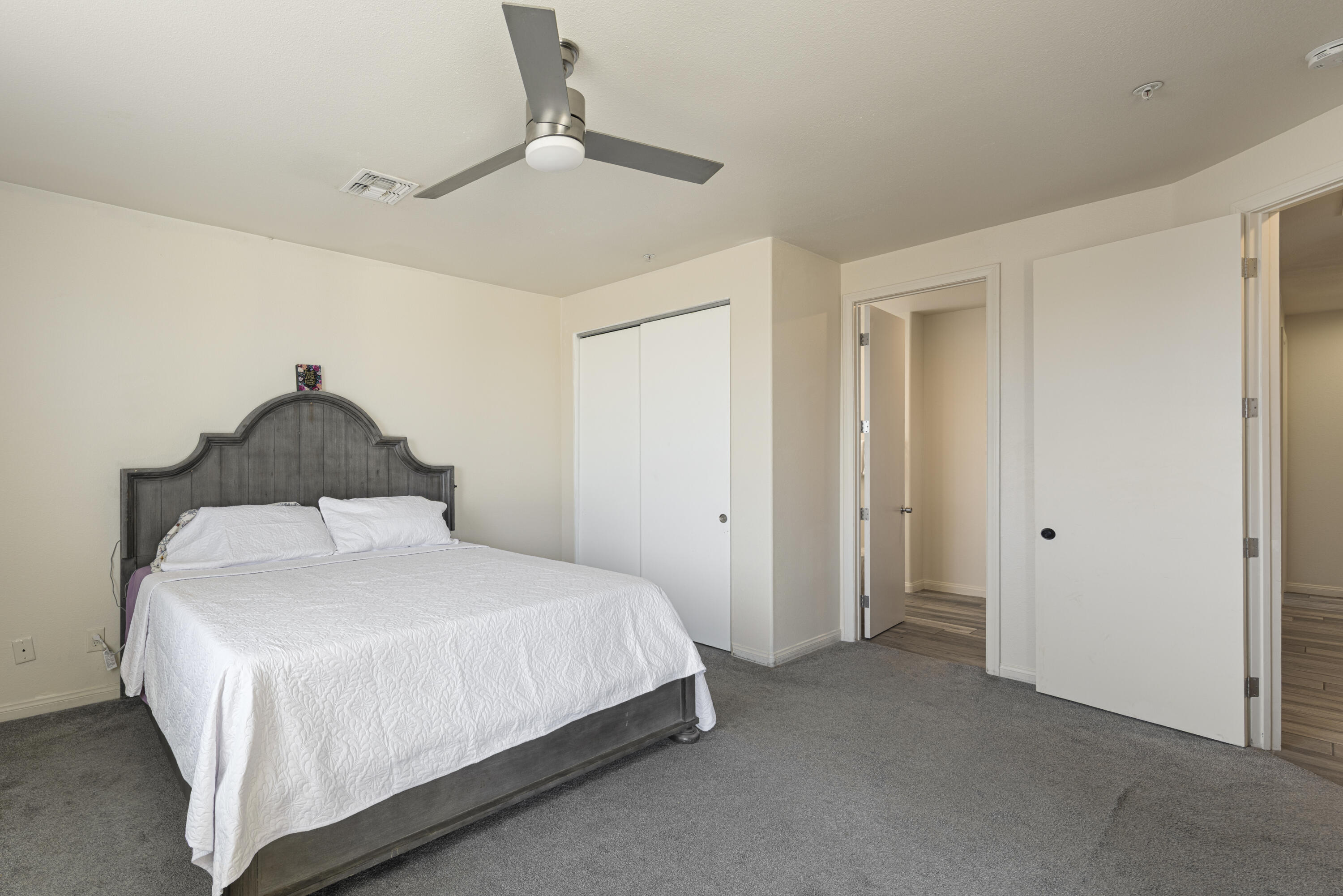 8680 Monument View Drive Yucca Valley, CA 92284 - Photo 23 of 51 a bedroom with a bed and a painting on the wall