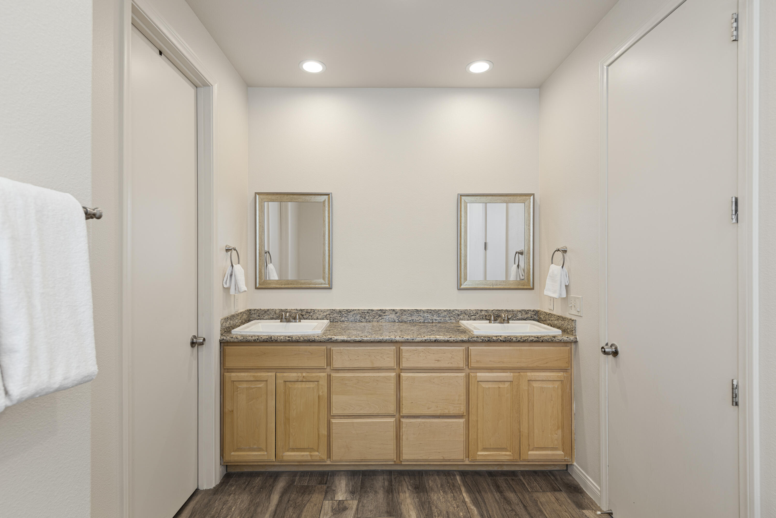 8680 Monument View Drive Yucca Valley, CA 92284 - Photo 24 of 51 a bathroom with a granite countertop sink and a mirror