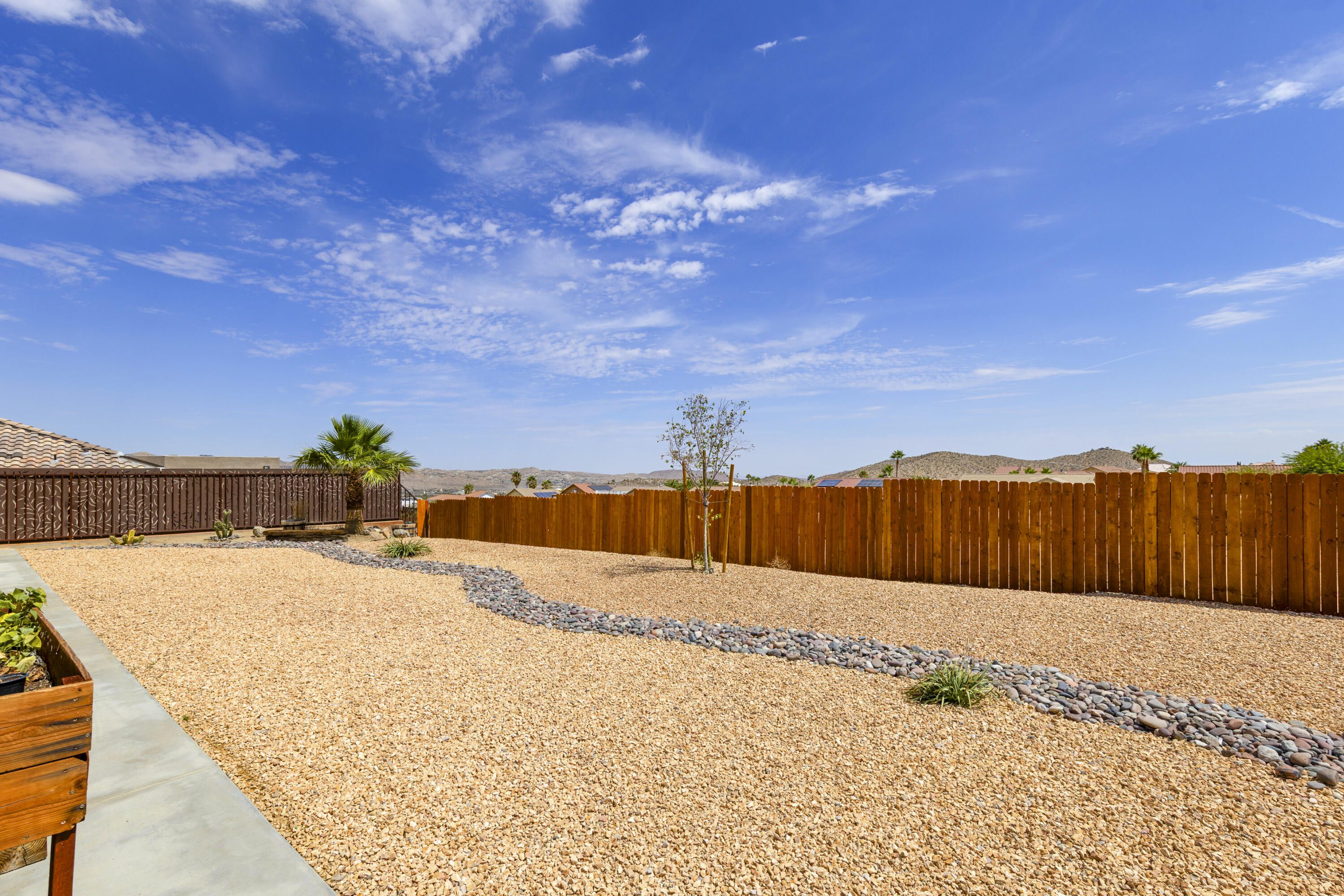 8680 Monument View Drive Yucca Valley, CA 92284 - Photo 34 of 51 a view of a backyard of the house