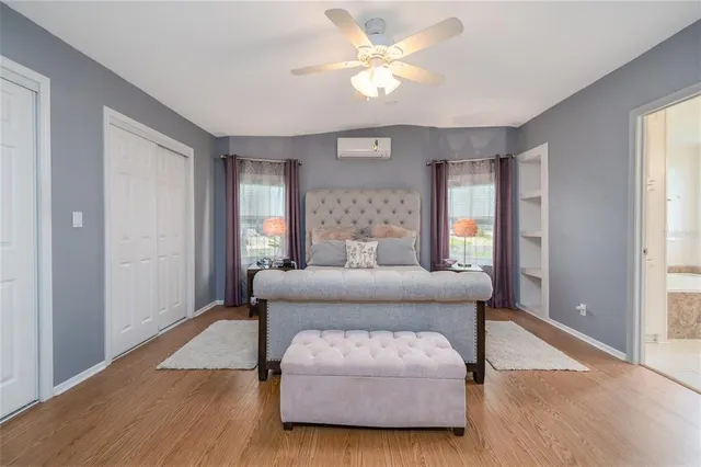 a bedroom with furniture and a window