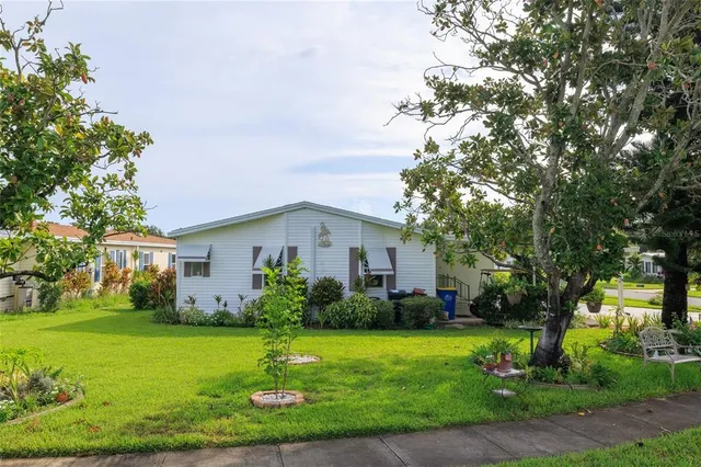 a front view of house with garden