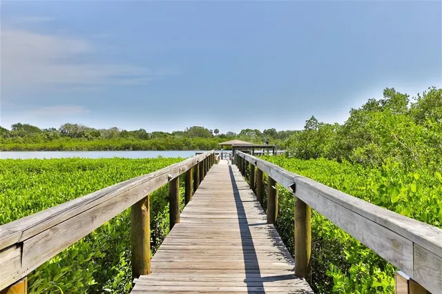 a view of a lake with houses in the back