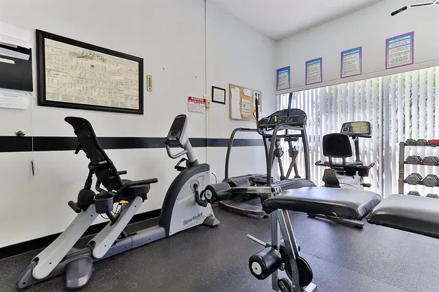 a living room with lots of furniture and a wooden floor