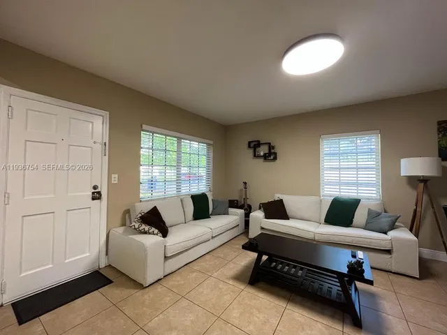 a living room with furniture and a couch