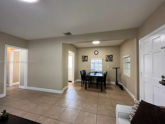 a view of a livingroom with furniture and window