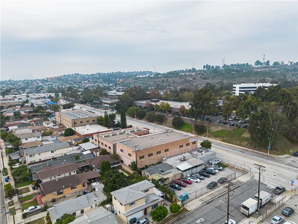 an aerial view of a house with a backyard