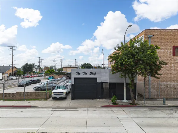 a view of a building with car parked