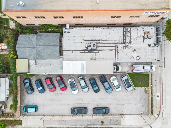 an aerial view of residential houses with city view