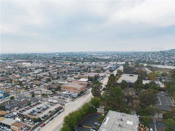 an aerial view of a house with a big yard