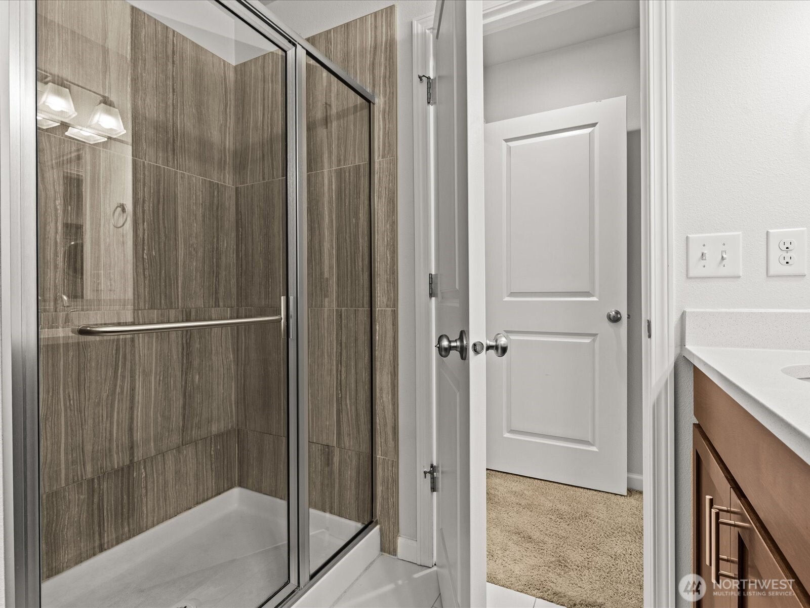 3400 Southwest Graham Street, Unit 703 Seattle, WA 98126 - Photo 17 of 28 a bathroom with a shower and a sink