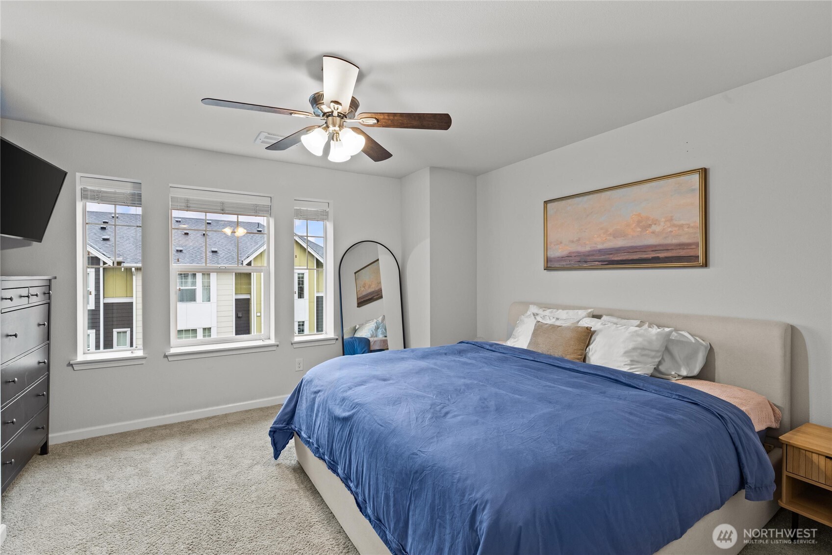 3400 Southwest Graham Street, Unit 703 Seattle, WA 98126 - Photo 18 of 28 a bedroom with a bed and a chandelier