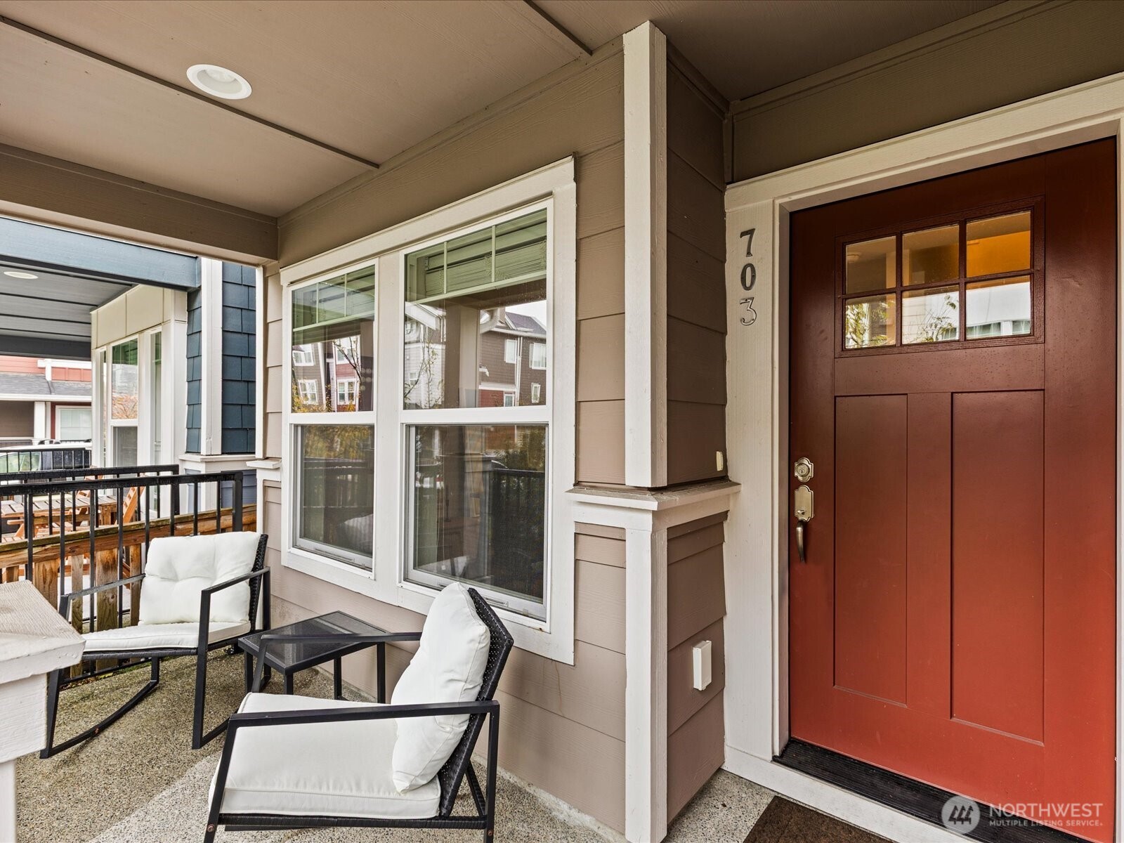 3400 Southwest Graham Street, Unit 703 Seattle, WA 98126 - Photo 2 of 28 a living room with furniture and a window