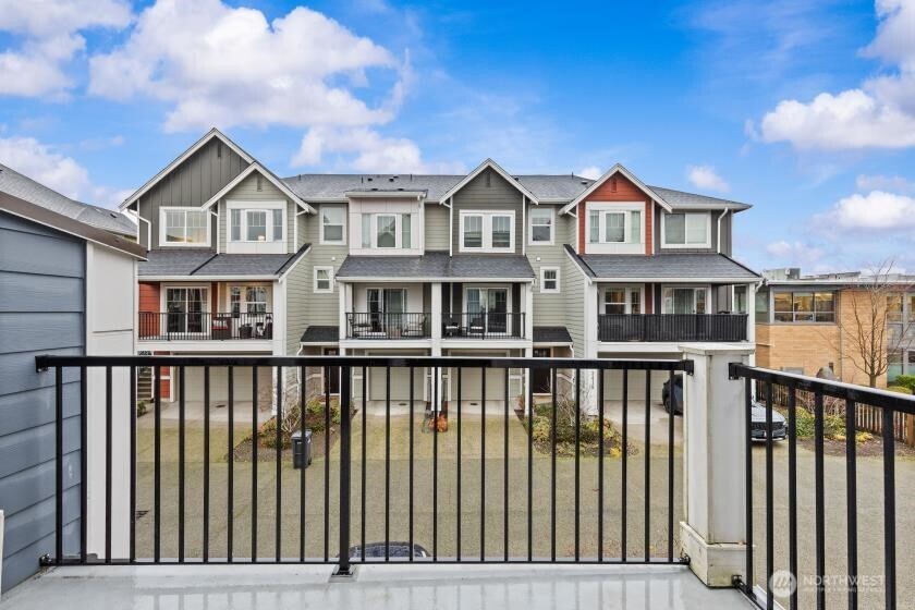 3400 Southwest Graham Street, Unit 703 Seattle, WA 98126 - Photo 27 of 28 a view of a brick house with large windows